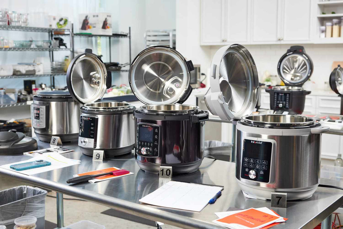3 Instant Pots sitting on a table in a kitchen